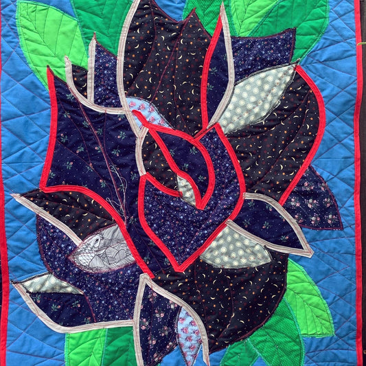closeup of black rose collage design, which shows the zig zag stitched background.