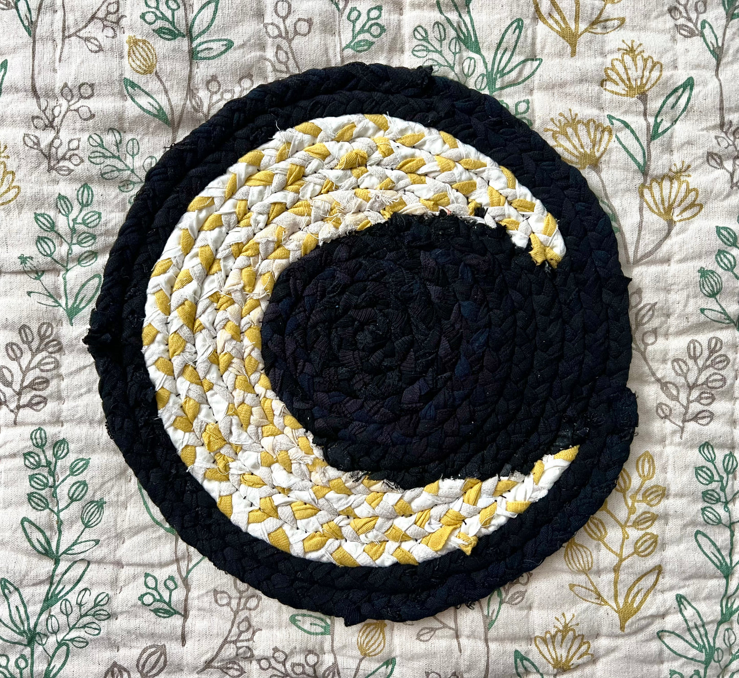 Crescent moon handbraided plant or candle mat, aerial view