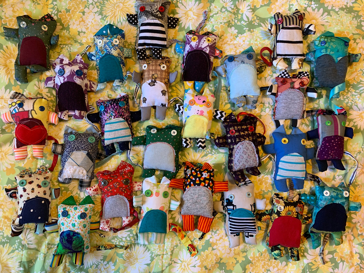 another aerial view of mini kitties against a floral green background