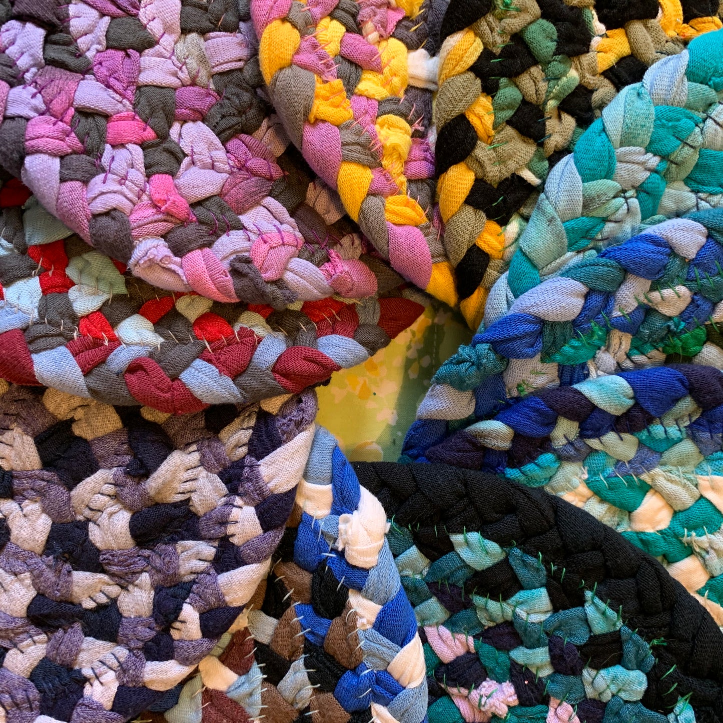 closeup of a group of colorful potholders, in a spiral formation.