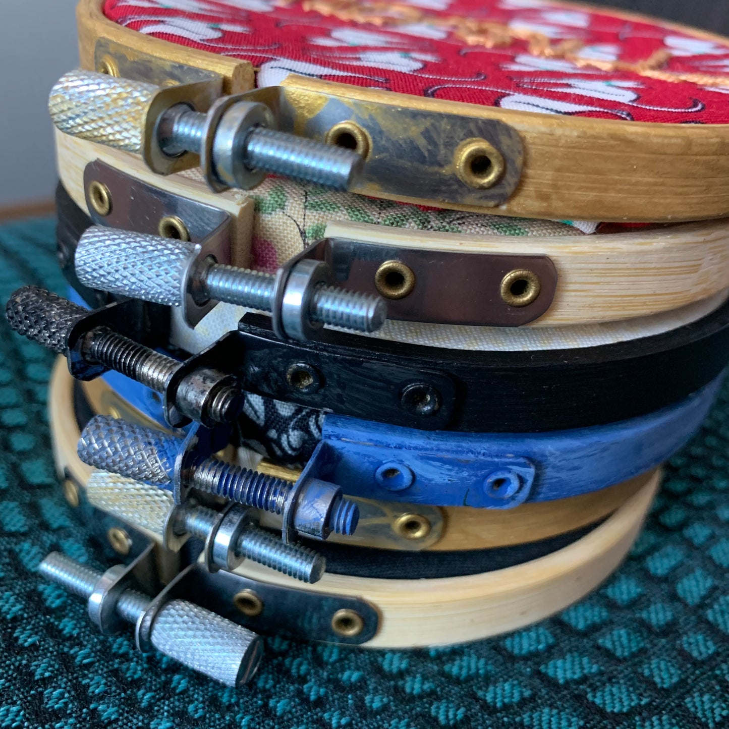 stack of embroidery hoops, side view closeup, so you can see the hardware