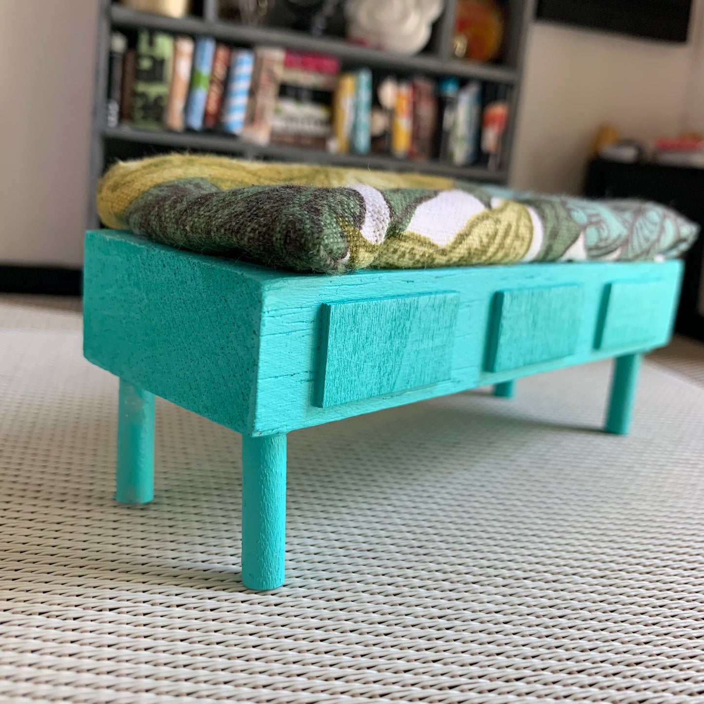 a miniature dollhouse bench, side view