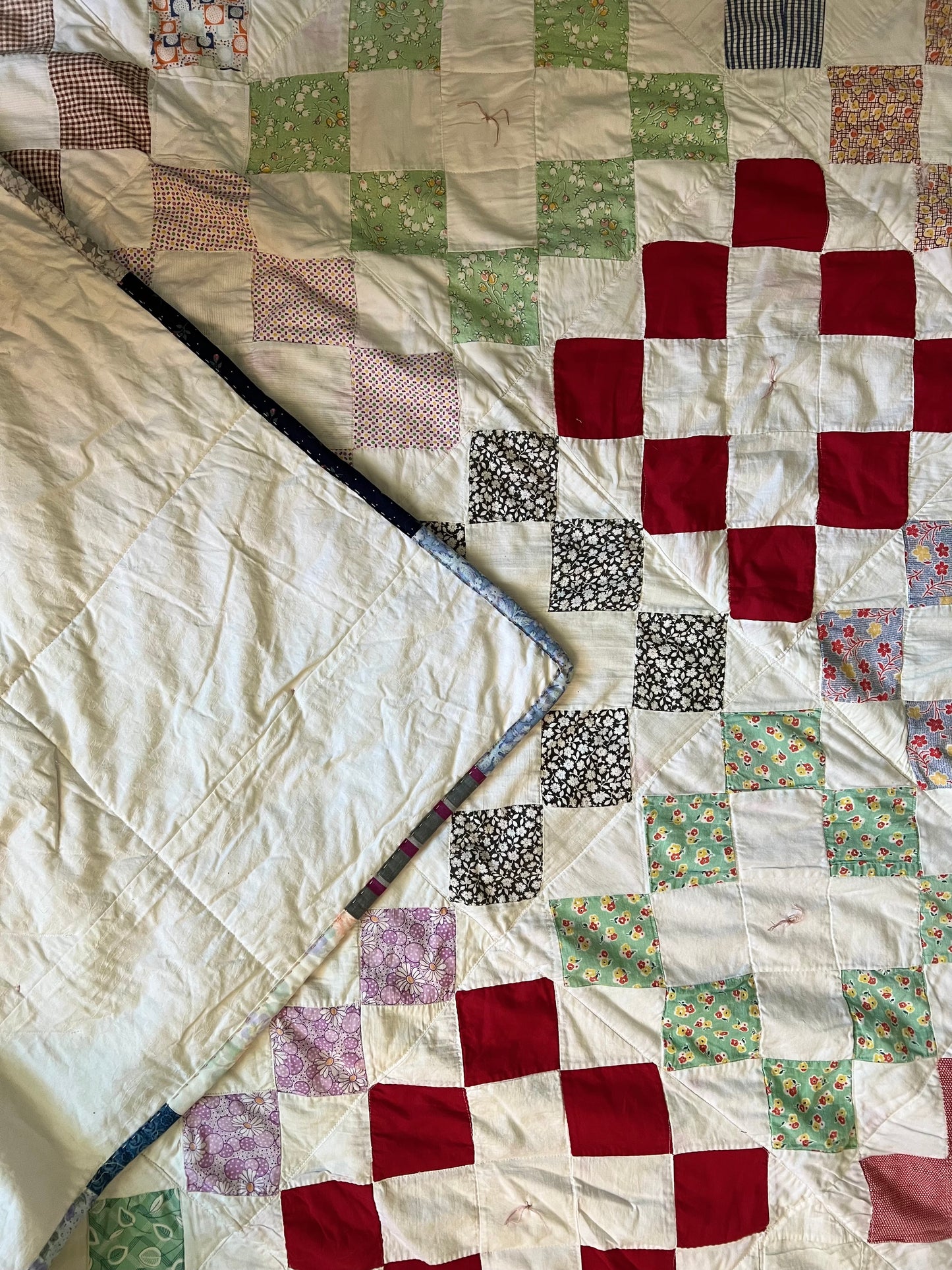 a back corner of the quilt has been folded over the front, to show contrast