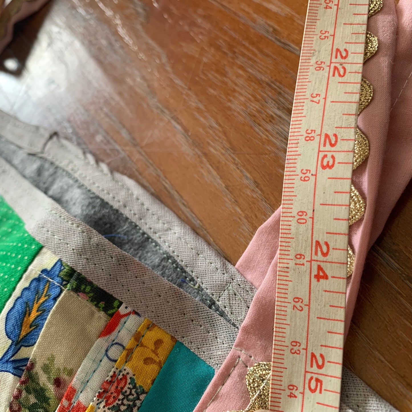 measuring tape along straps, closeup on measure of 25 inches