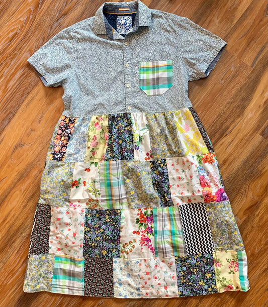 a patchwork shirt dress, with button-up top part, and patchwork shirt bottom part. on a wood floor background