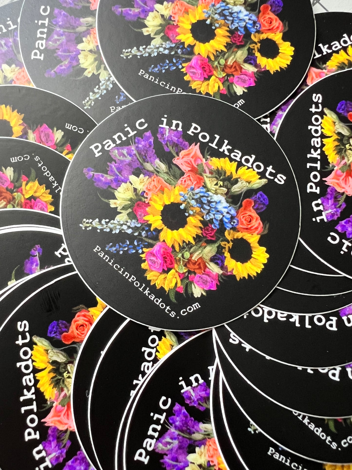 Panic in Polkadots, Stack of stickers, aerial view. Panic in Polkadots dot com