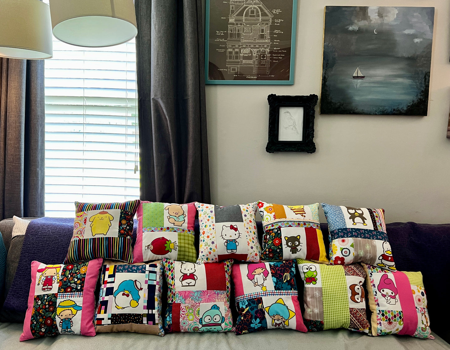 A group of cute Sanrio character pillows on a couch