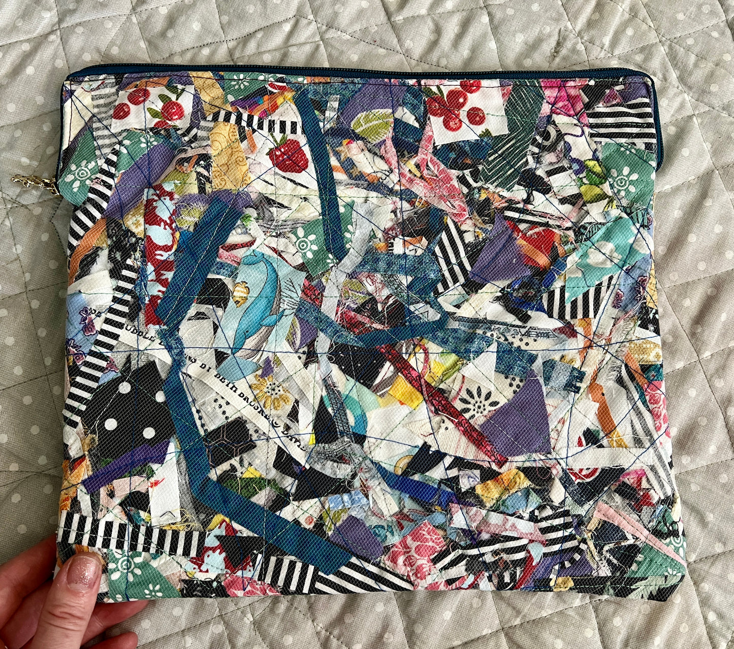 ipad case stripes whale, held in the corner for scale, against a polkadot quilt background