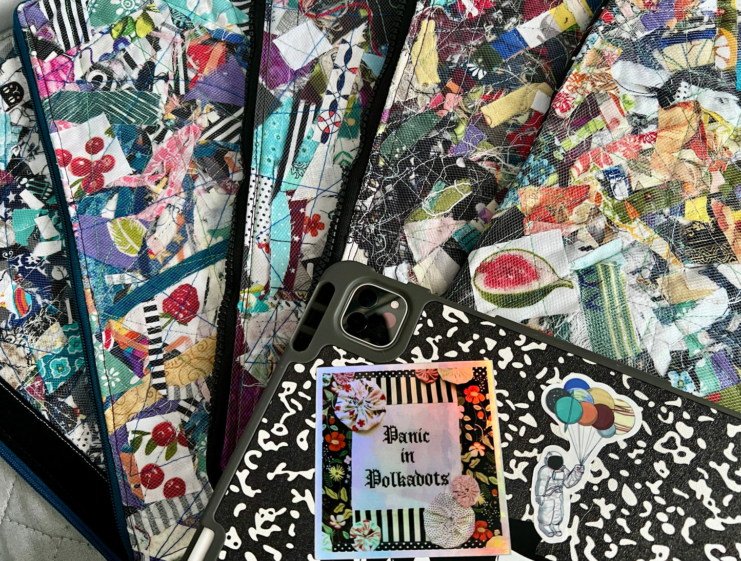 ipad cases in a group, Panic in Polkadots sticker on an ipad in front of cases, for scale