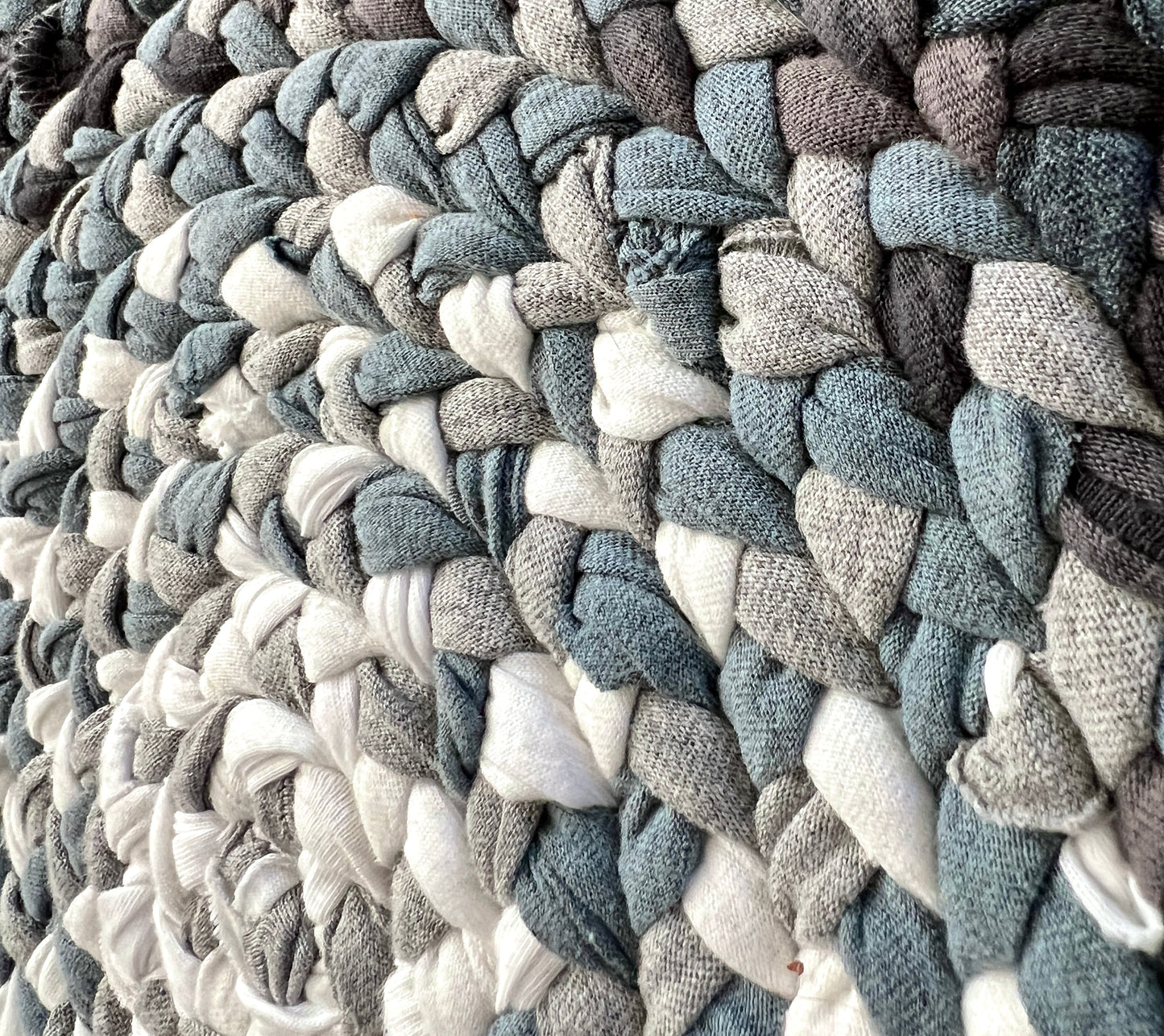closeup of top of ombre tshirt rug, showing off detail of the braids