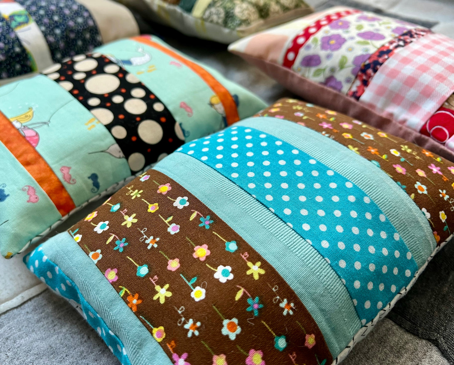 American Girl doll pillow, made from scrappy fabric strips, Side view