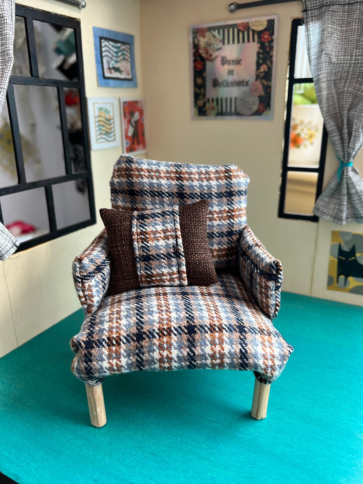 A Barbie 1:6 scale chair sits inside a room box for styling and scale, coordinating pillow included