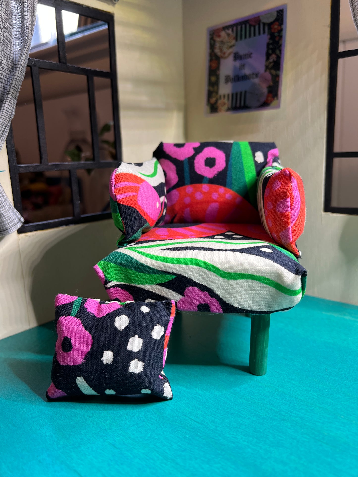 Barbie Chair snakes and leaves bright pink and green design, with pillow set down to the side of chair
