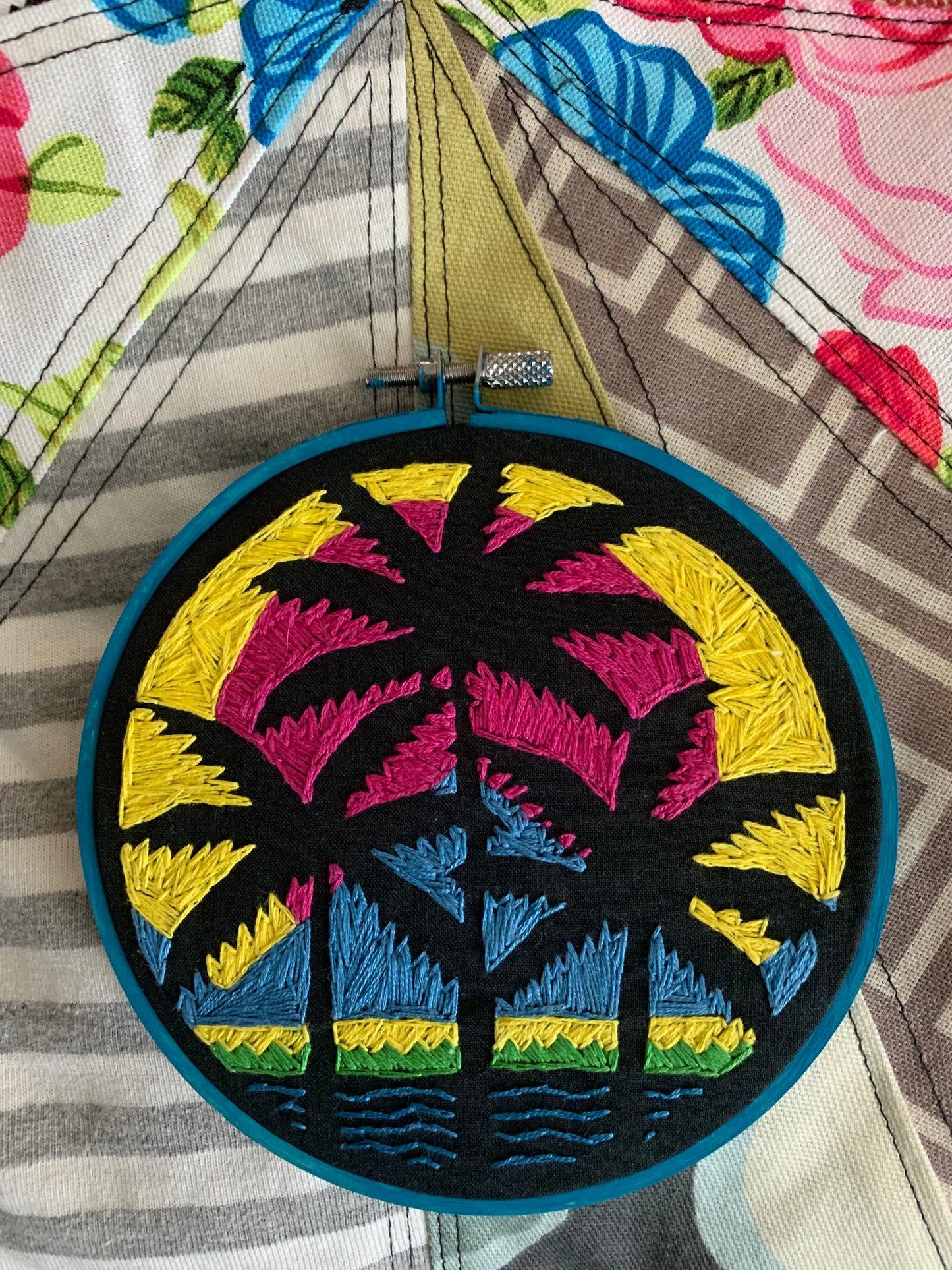 embroidery hoop with vibrant neon colors, art inspired by Blaqk Audio Beneath the Black Palms album art
