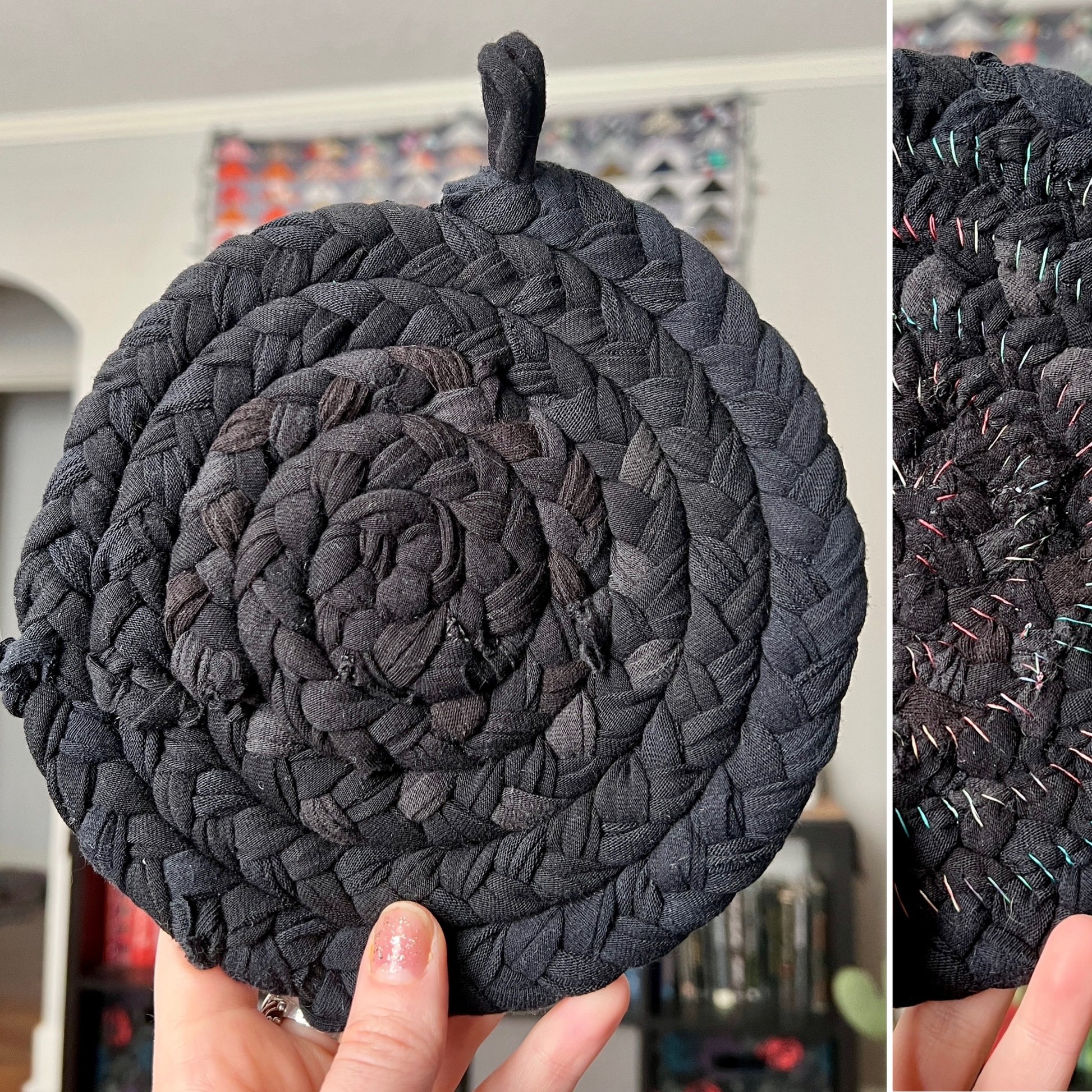 Black braided trivet held by a hand with a blurred background