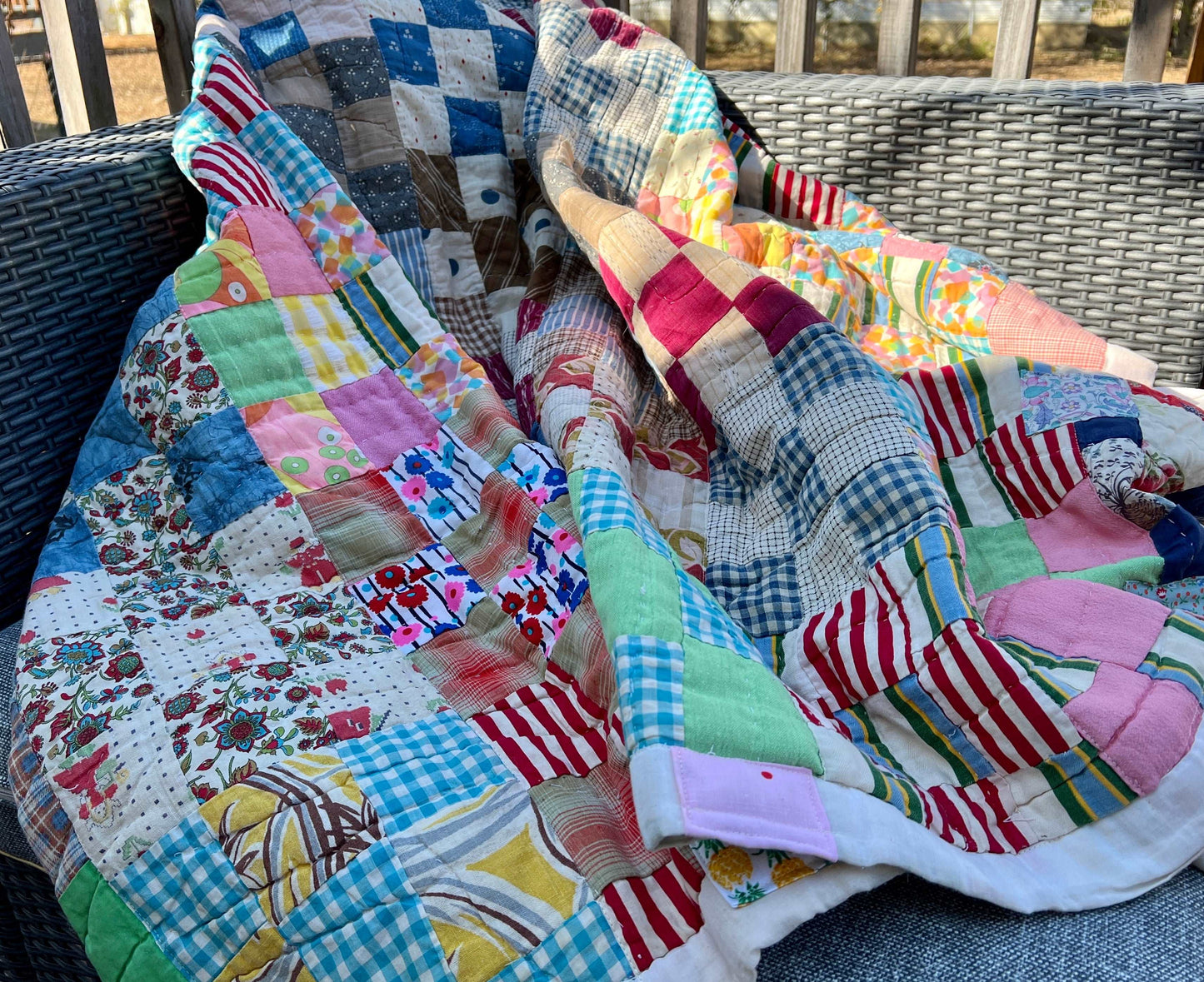 9 Vintage Quilt - Colorful Neon Nine Squares - Quilt Art - Full Sized, folded and bundled on an outside chair, very inviting cuddly quilt