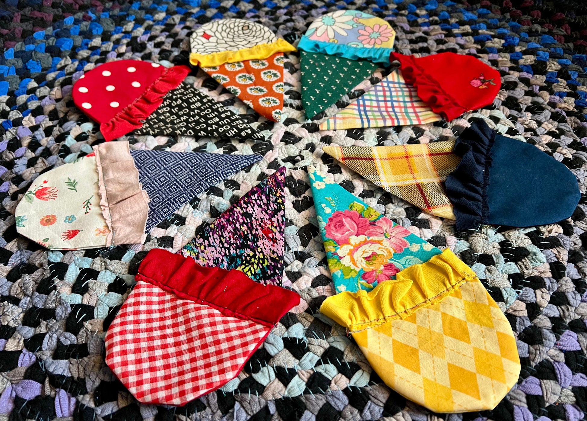 Colorful fabric ice cream cone patches on a textured multicolored rug