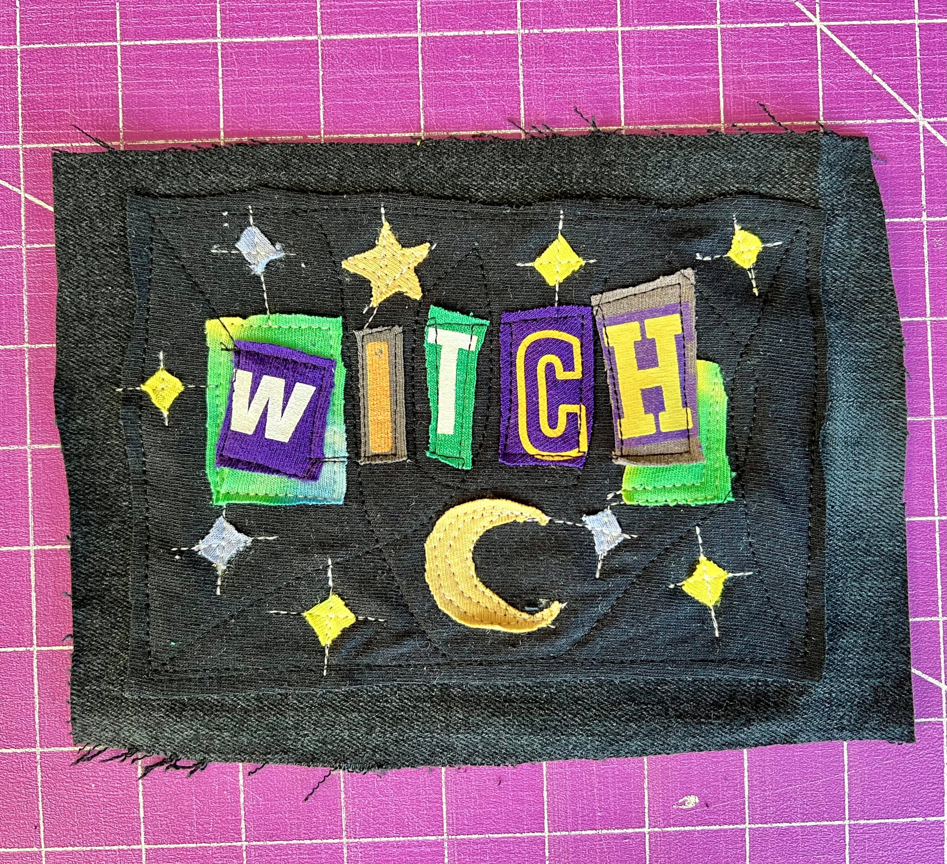 Custom ransom note patch with 'WITCH' text on a purple grid background