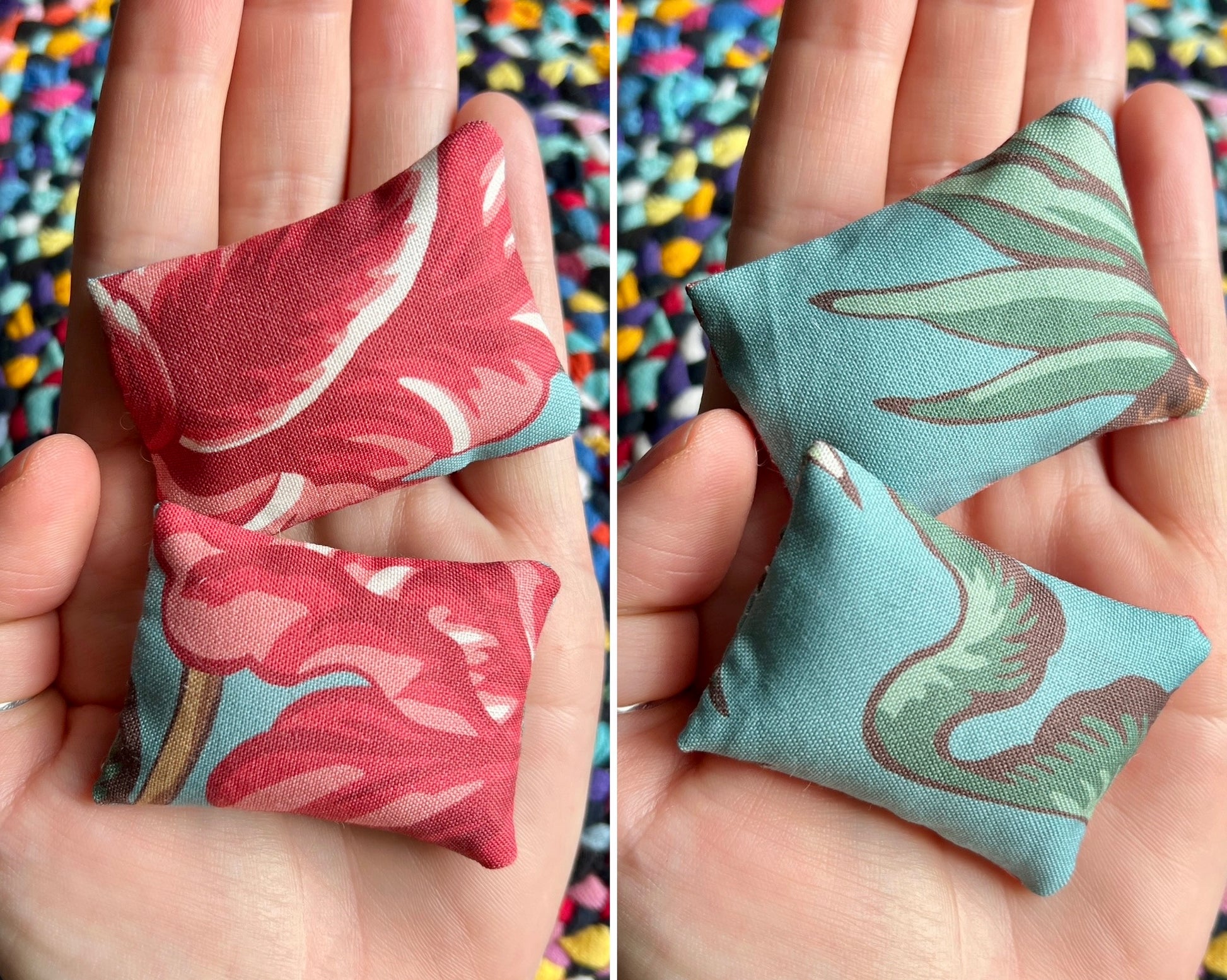 Two small fabric pillows with floral patterns held in hands against a colorful background.