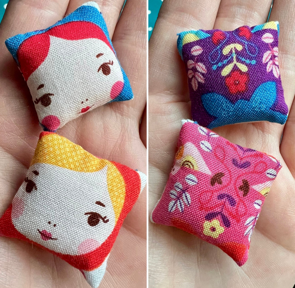 Four small fabric pillows with colorful patterns held in hands.