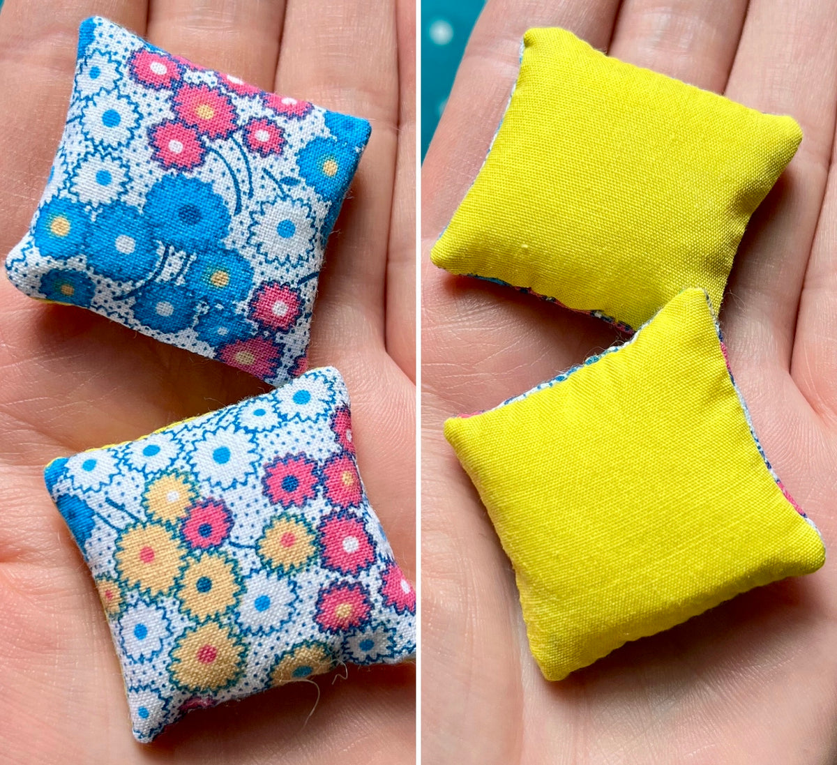 Two small fabric pillows, front with floral pattern and back solid yellow, held in hands.