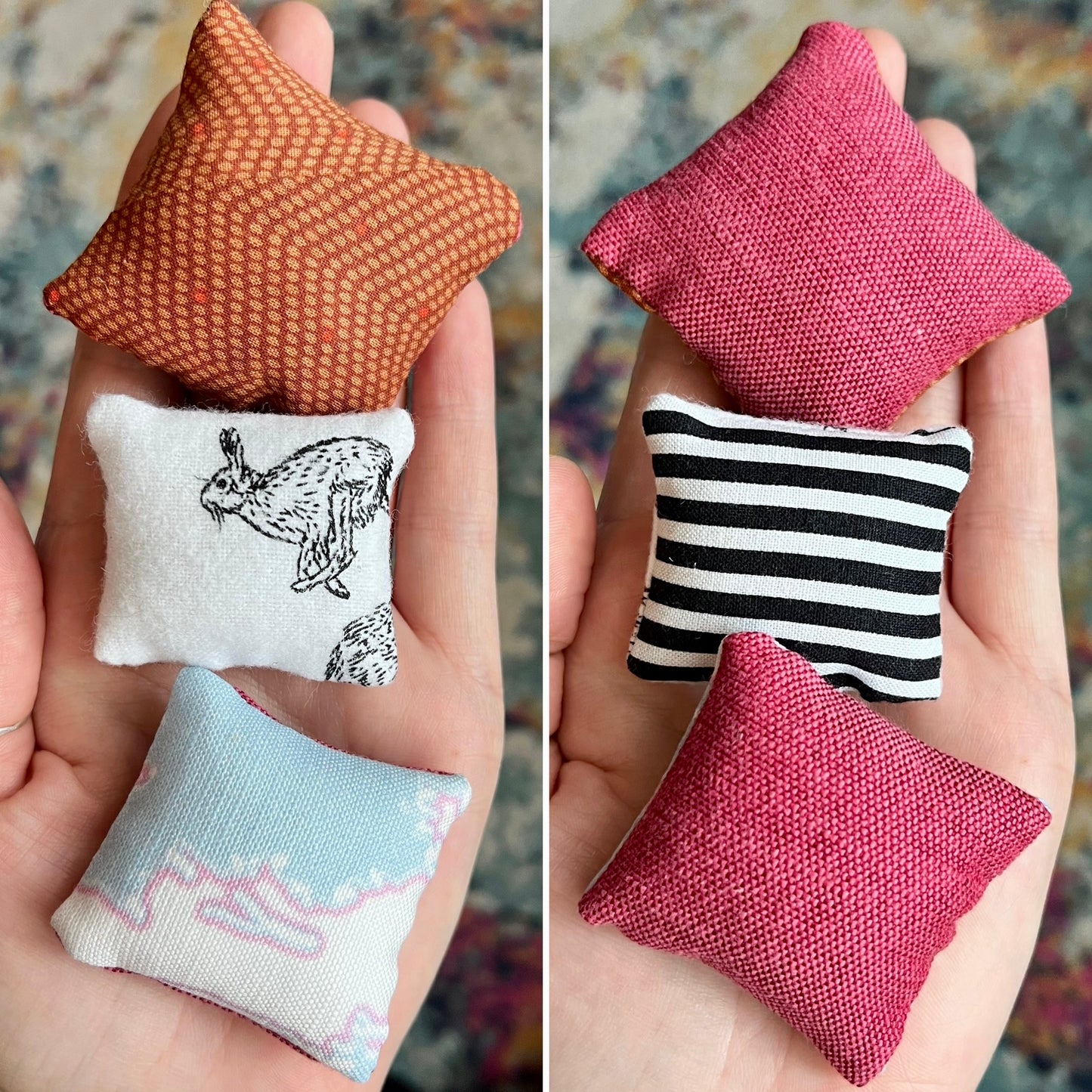 Small fabric pillows held in hands against a blurred background