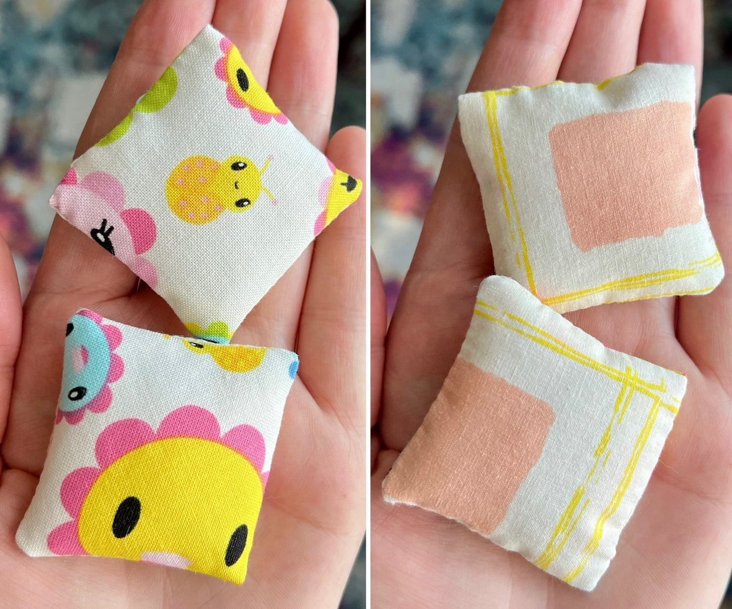 Small fabric dollhouse pillows with cartoon designs held in hands against a blurred background