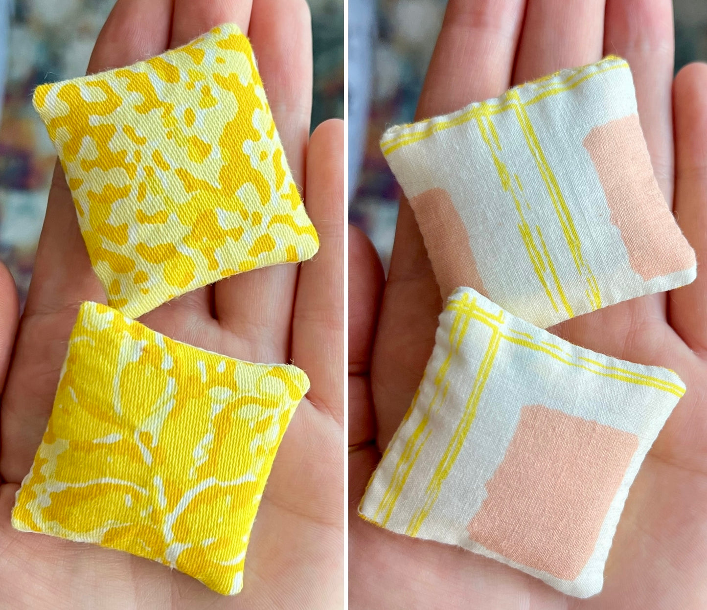 Two small dollhouse pillows with yellow, peach and white patterns held in hands.
