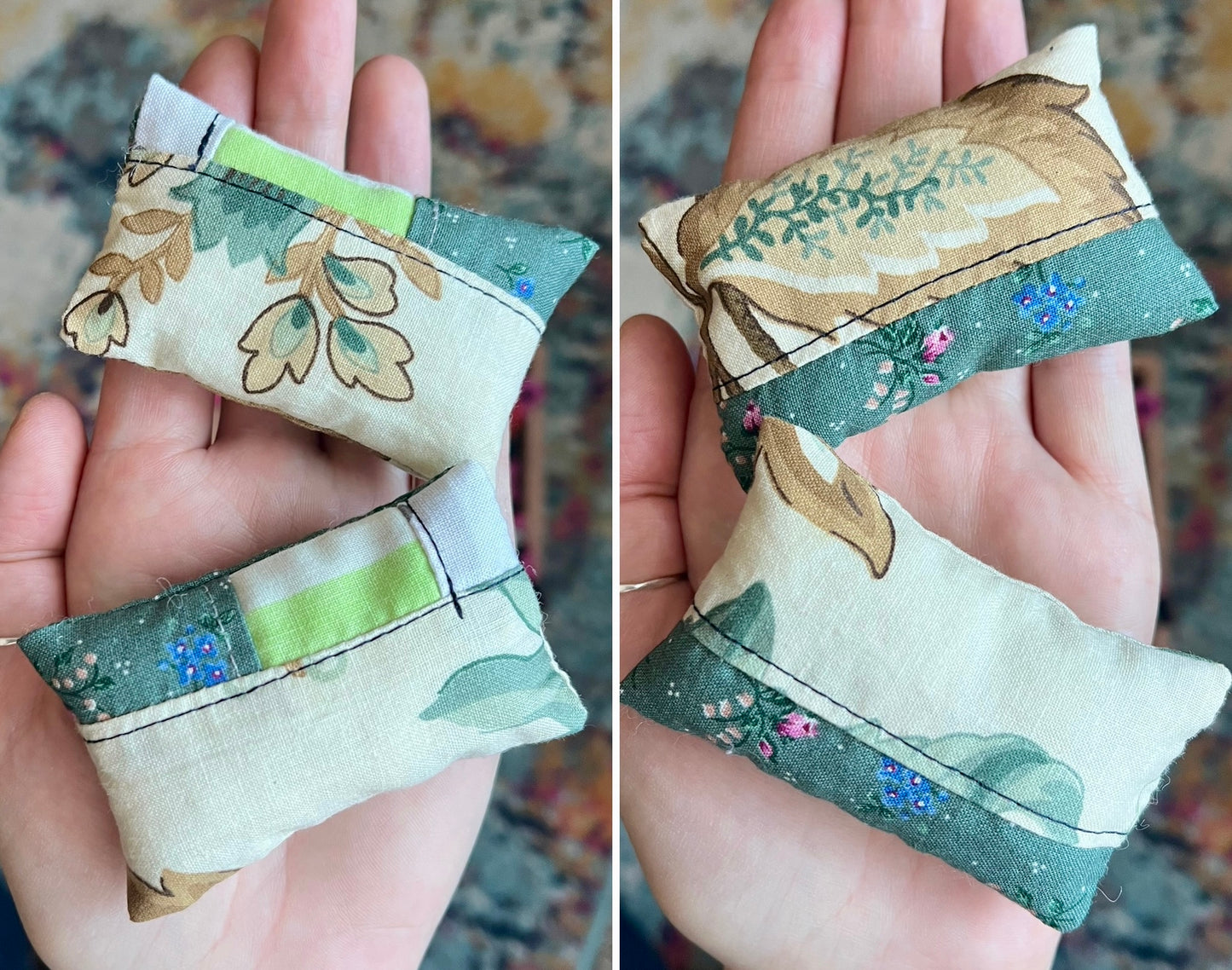 Two fabric pillows with floral patterns held in hands, showing front and back against a blurred background