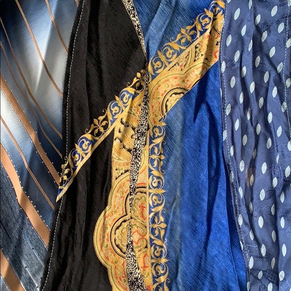 Blue and gold necktie skirt, closeup of one of the ornate neckties