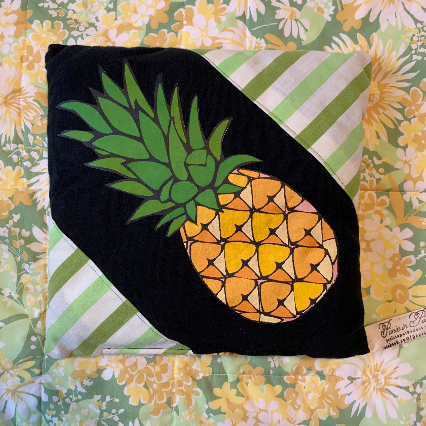 front view of Pineapple Stripes pillow. Created from a pineapple tshirt