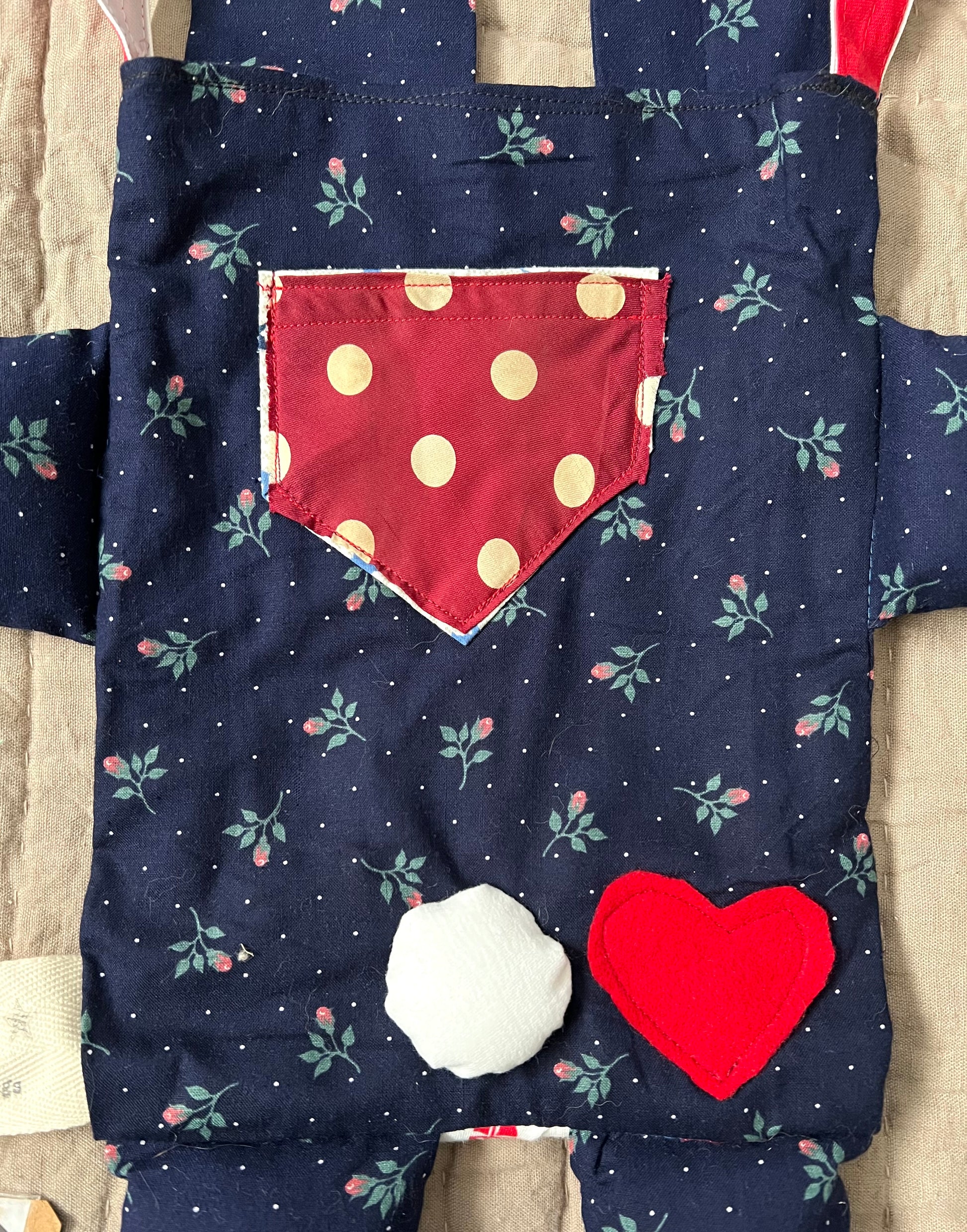 back of bunny tote bag, showing puffy bunny tail, red felt heart on the bum, and a necktie pocket.