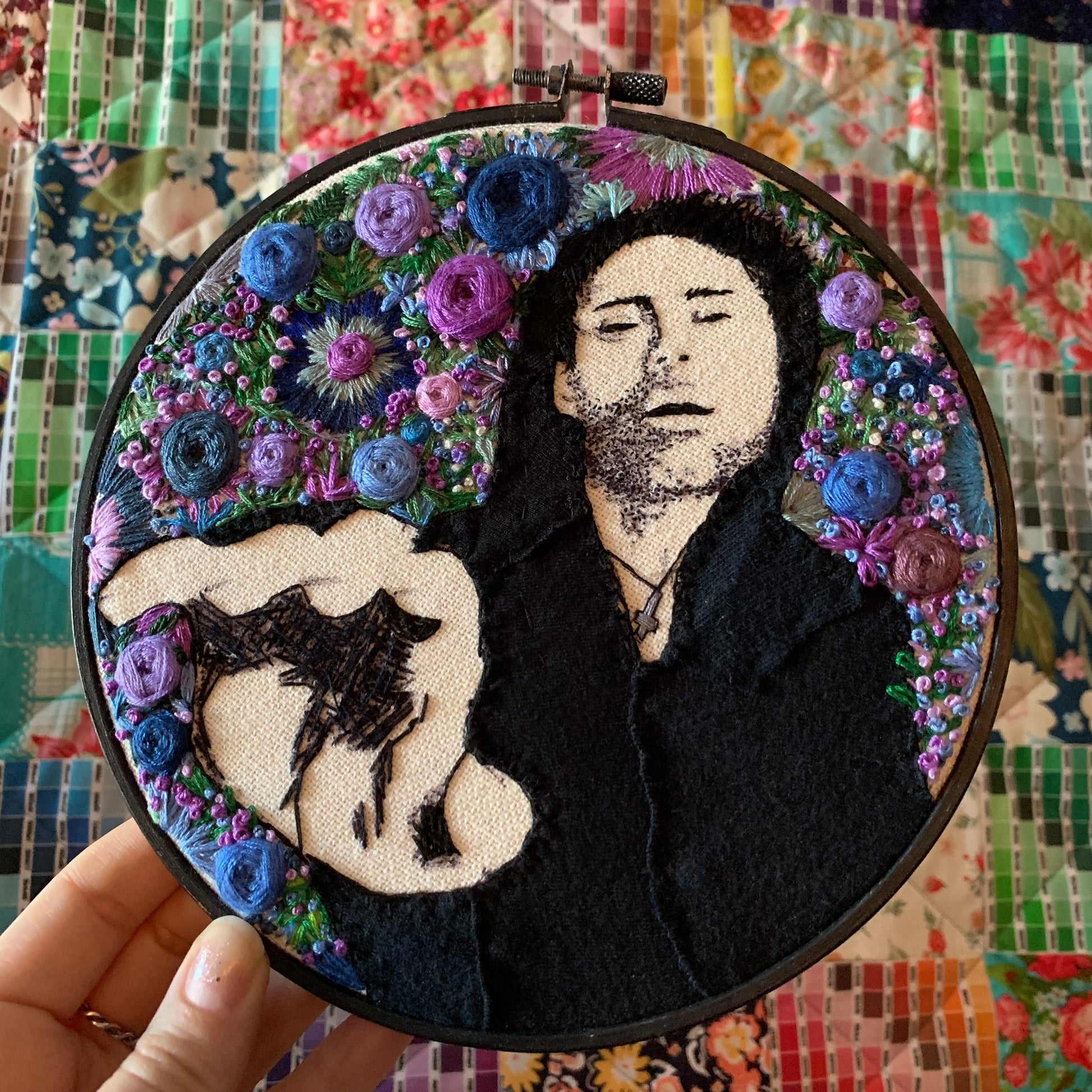 embroidery hoop featuring Davey Havok of AFI, hoop is held up against a colorful background