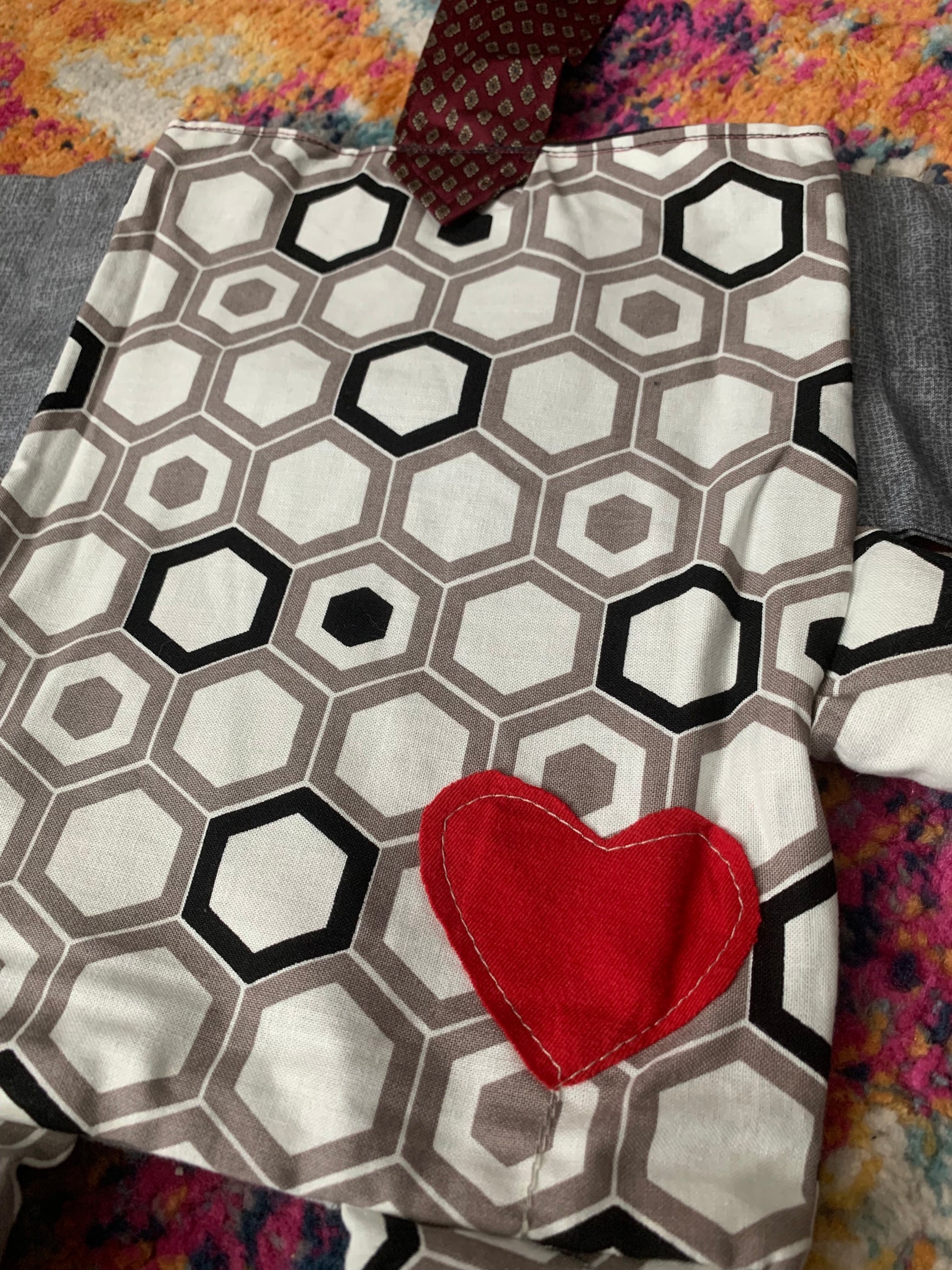 closeup of back of hexagon elephant, with red heart on its bum