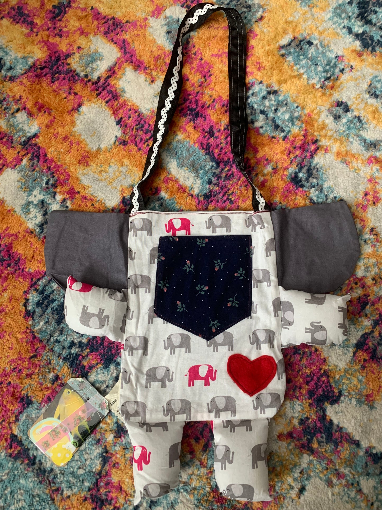 back of elephant tote bag, with red heart on the tummy, and a floral pocket