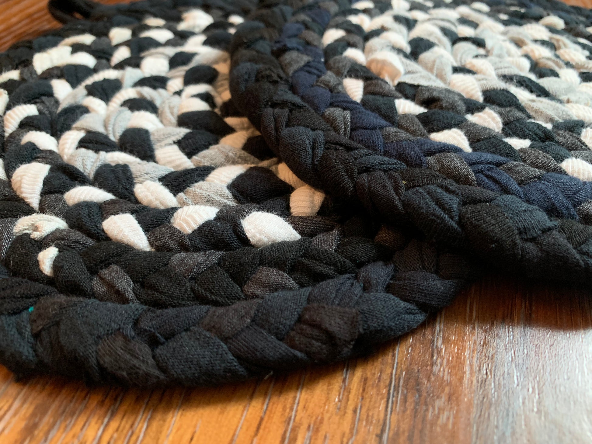 Closeup, side view of trivet potholders, on a wood surface.