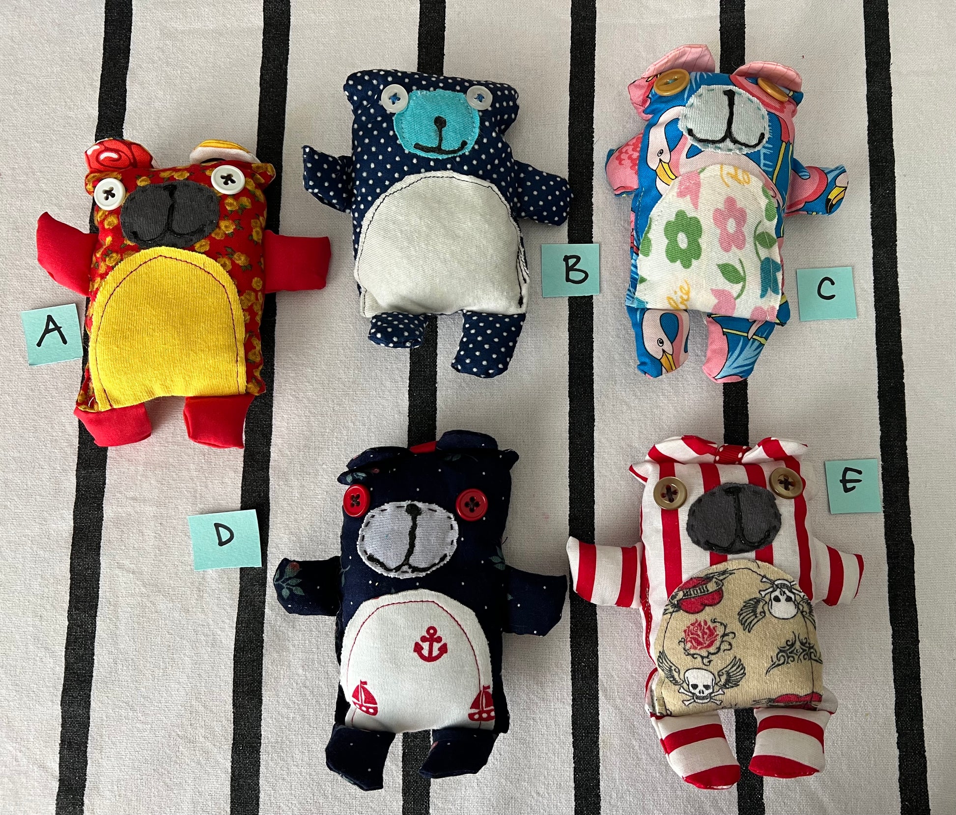 front view of mini animals with letters A B C D E next to each one.