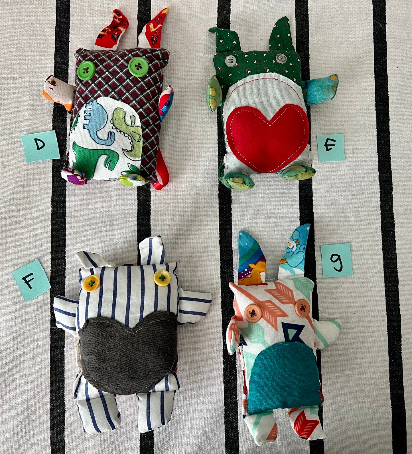 front view of mini animals with letters D E F G next to each one.
