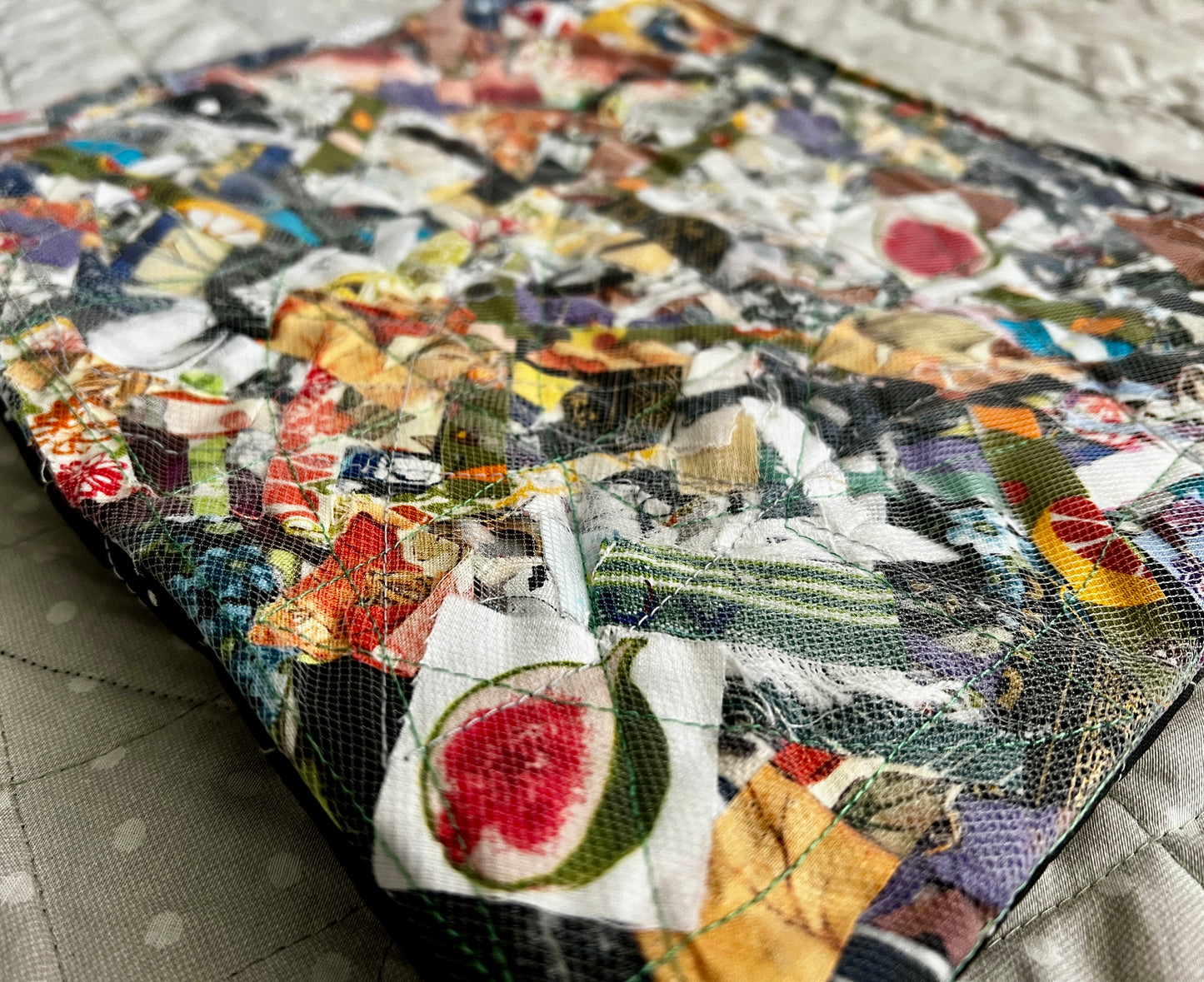 Ipad case closeup, showing the beautiful texture of scraps under tulle mesh