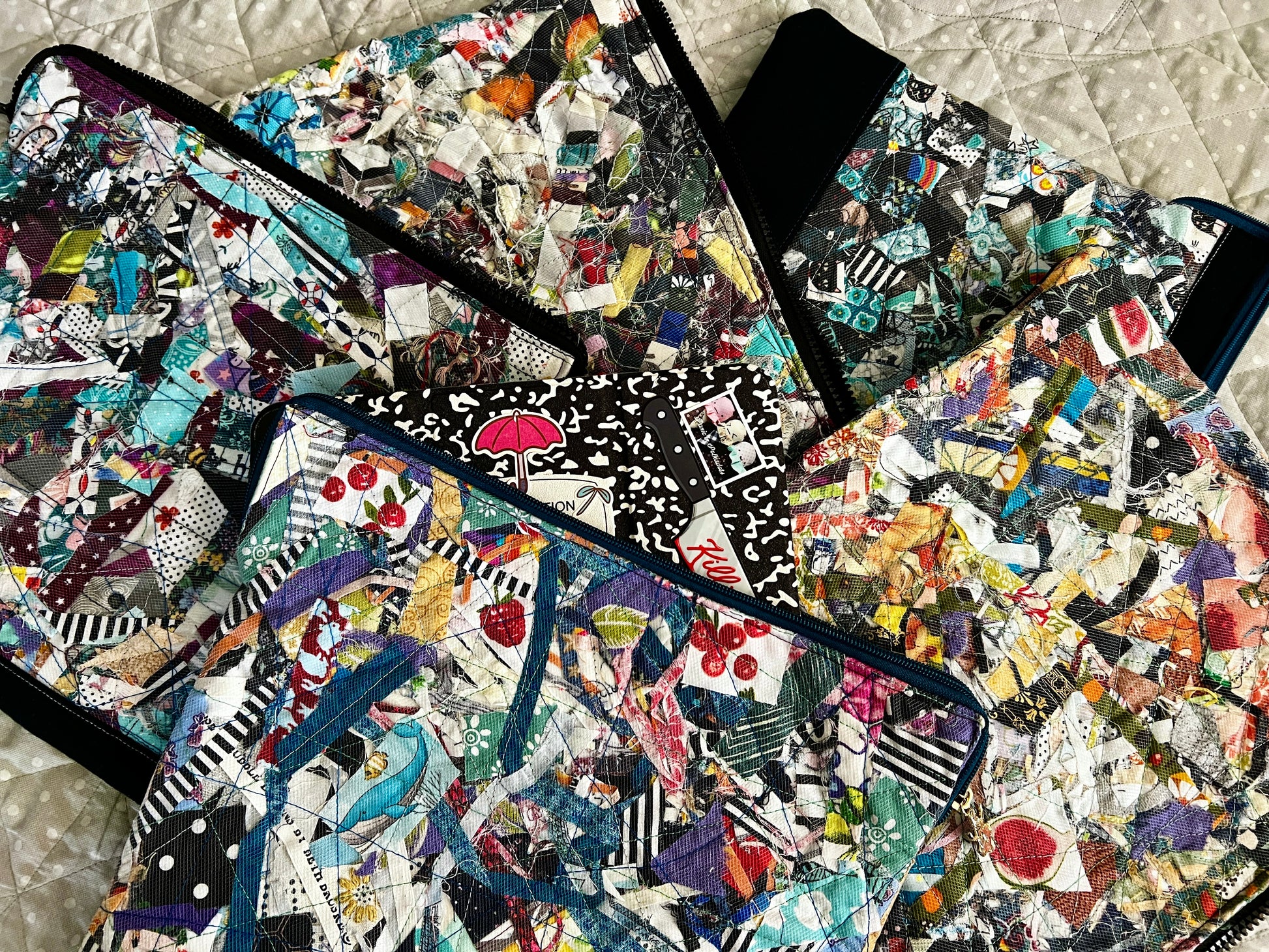 An assortment of ipad cases, one has my ipad inside, peeking a corner out