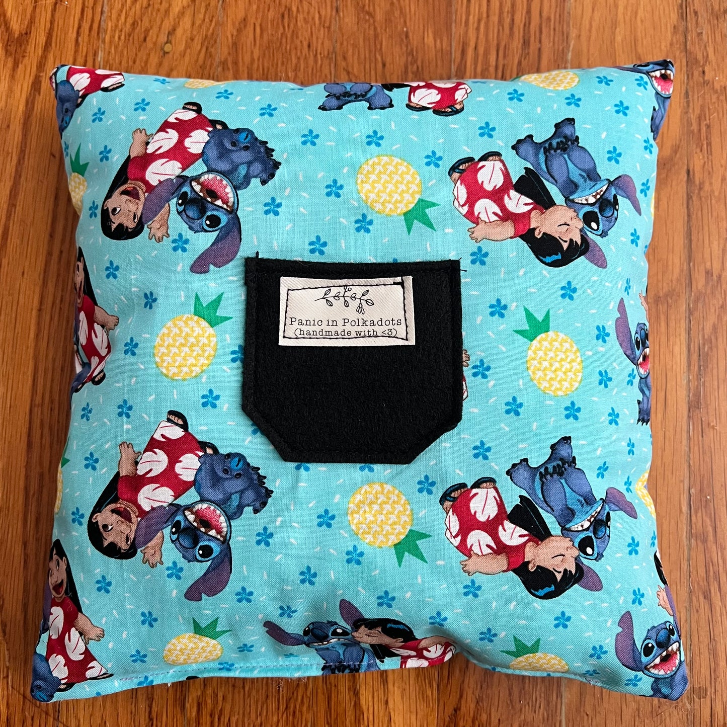 Back view of stitch pillow, showing Lilo & Stitch fabric and a pocket for tooth fairy collection