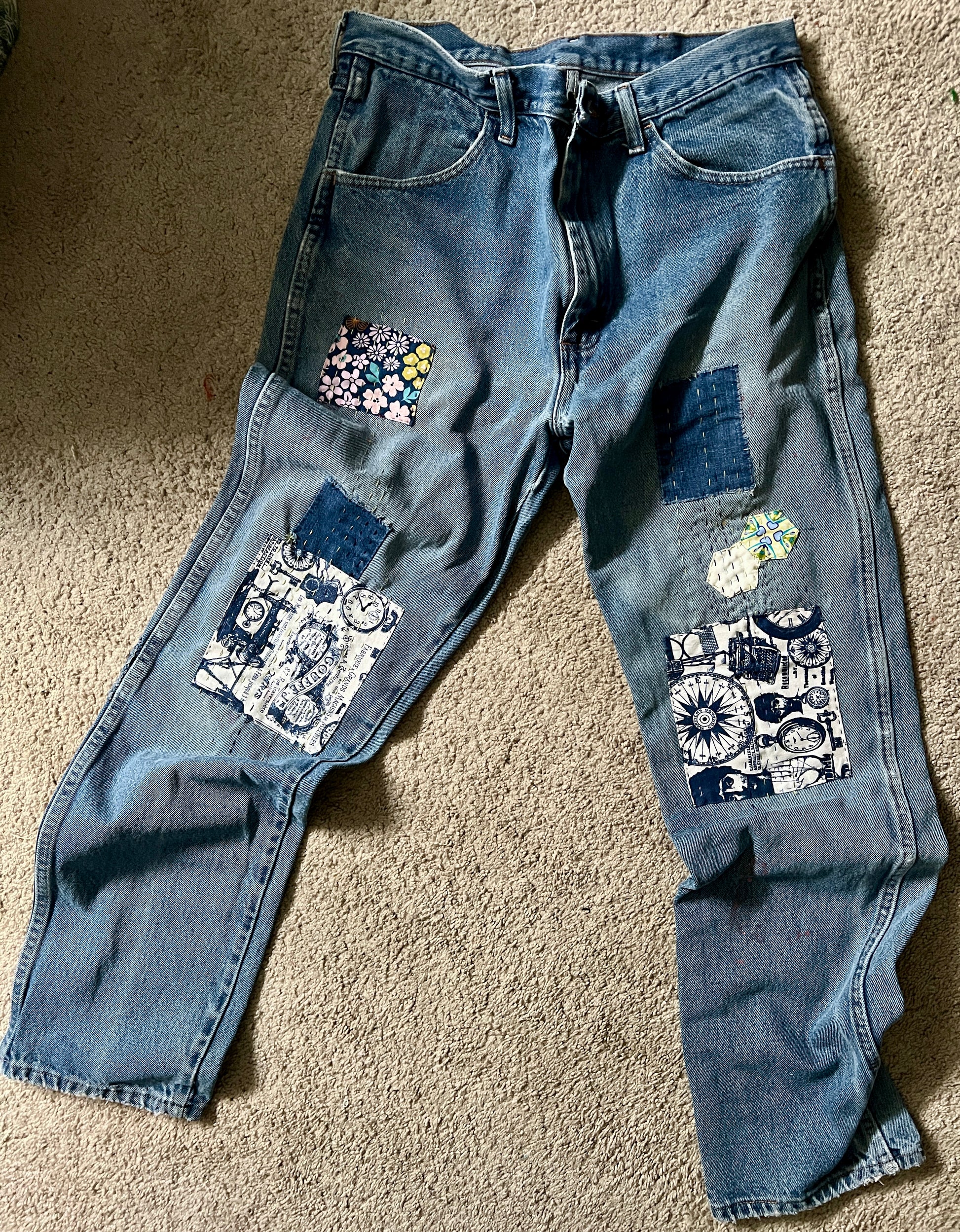 Panic clothing, denim jeans with blue advertisement fabric added to prolong their life