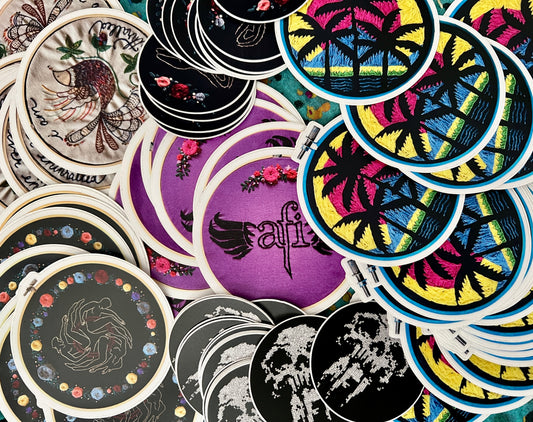Panic in Polkadots and afi stickers, arrayed in a random pile