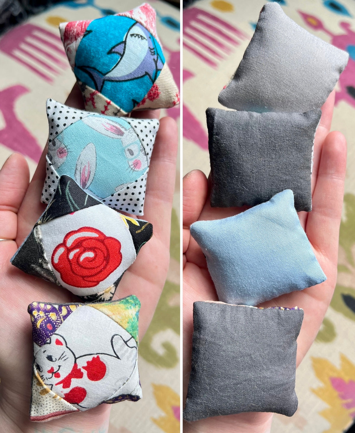 Small fabric pillows with various designs held in hands against a colorful background.