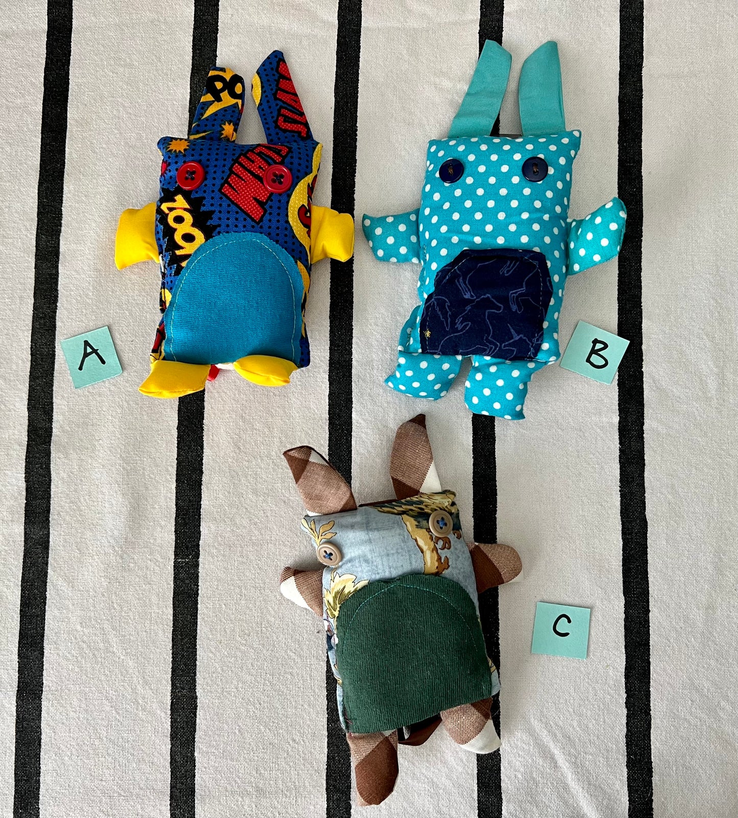 front view of mini animals with letters A B C next to each one.