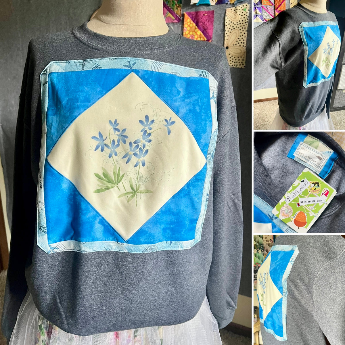 A collage showing a dark gray crewneck sweatshirt with a large blue and cream diamond quilted patch on the front featuring blue flowers and green leaves. The left main panel shows the sweatshirt on a dress form, while the right side panels show close-ups of the patch, the back view, and the interior tag.