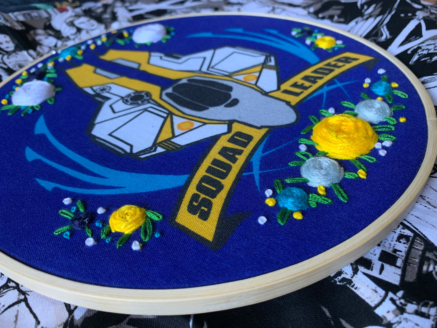 Side view of squad leader embroidery hoop with flowers