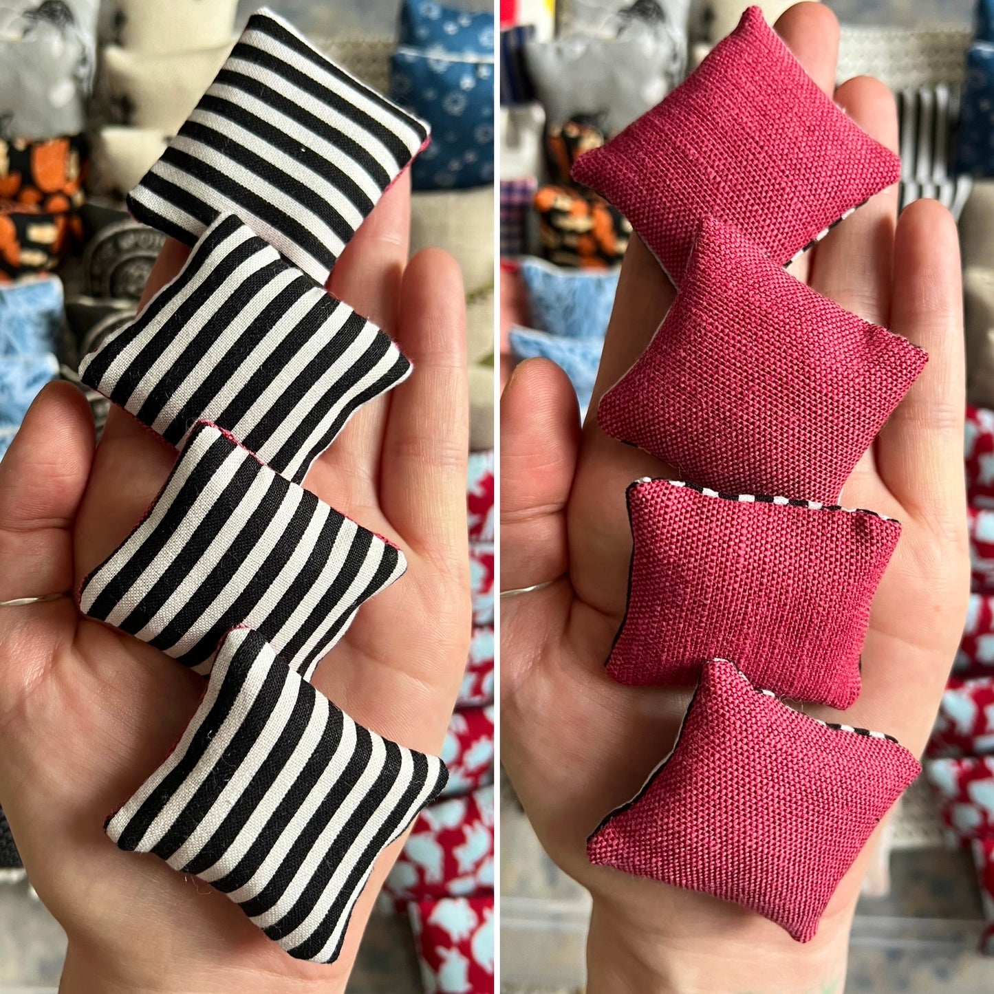Small fabric pillows in black and white stripes held in a hand for scale, showing front and back (magenta) designs. 