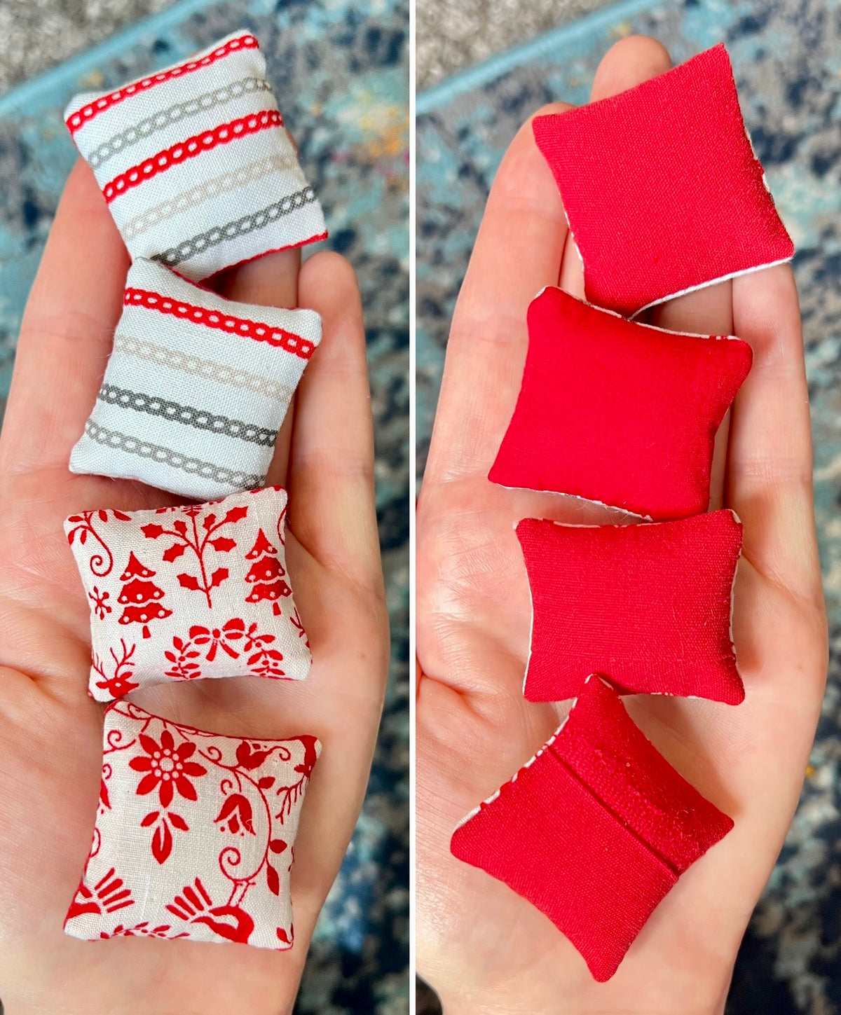 Small fabric pillows with red and white patterns held in a hand.