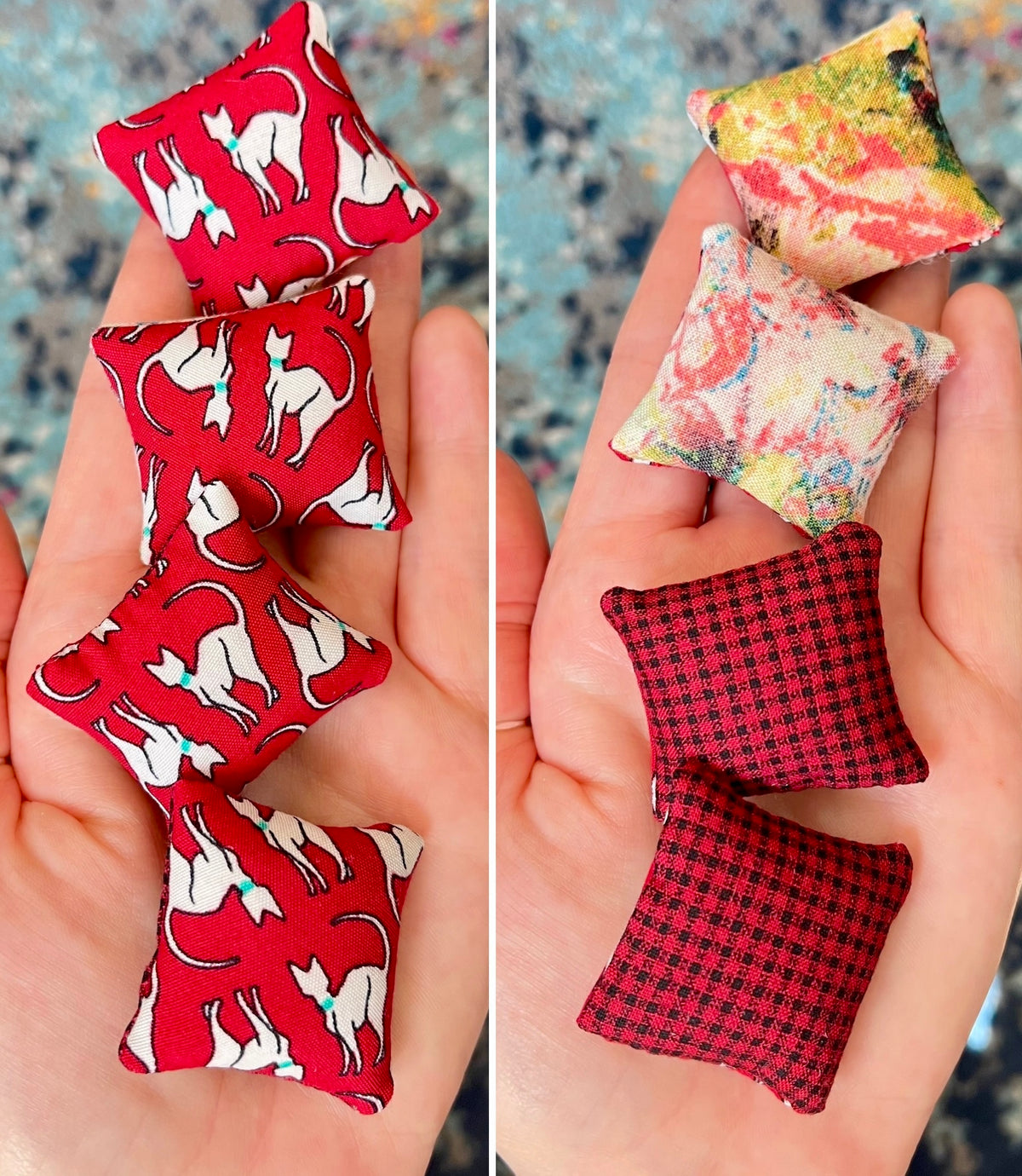 Two sets of small fabric pillows held in hands, one with red cat pattern and the other with floral and checkered patterns.